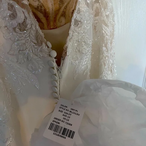 Brand new designer wedding dress, never altered, size 10